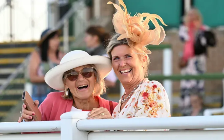 Two ladies at Great Yarmouth pose with big smile for the camera